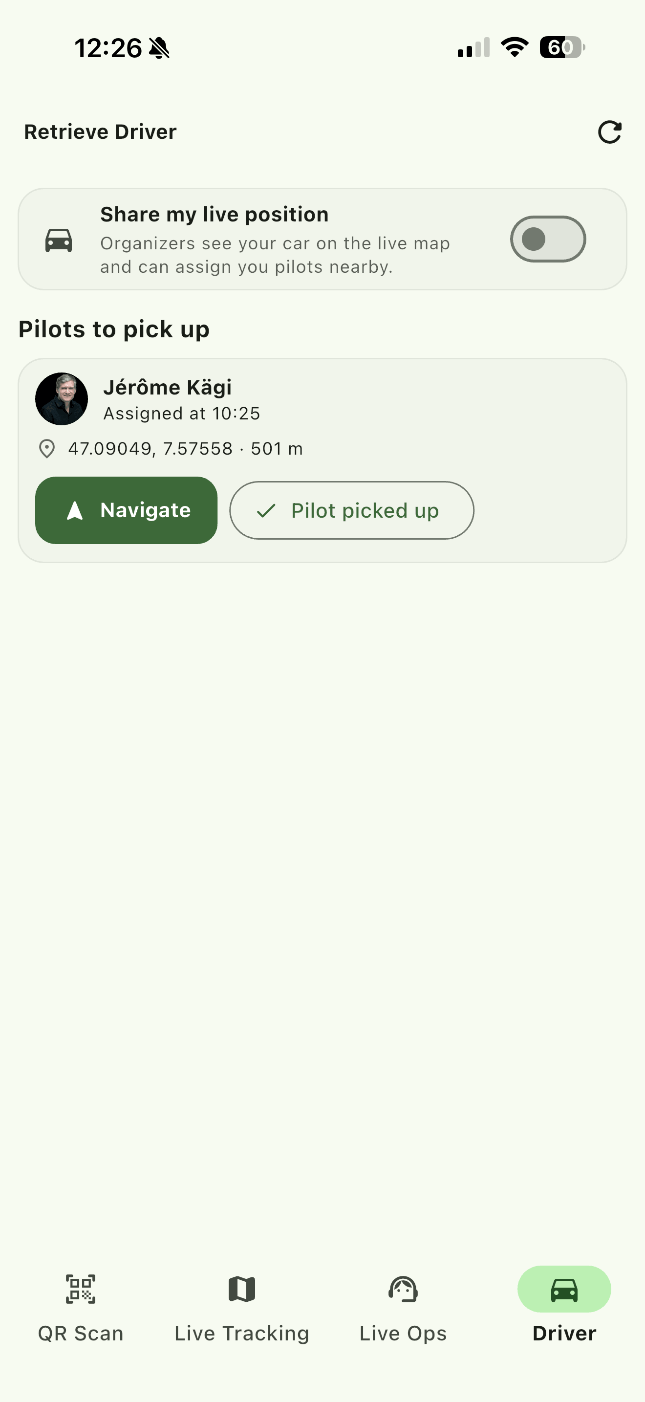 An assigned pickup: the pilot, when they were assigned, where they landed, and the two things you can do about it. There is no distance badge here because sharing is off.